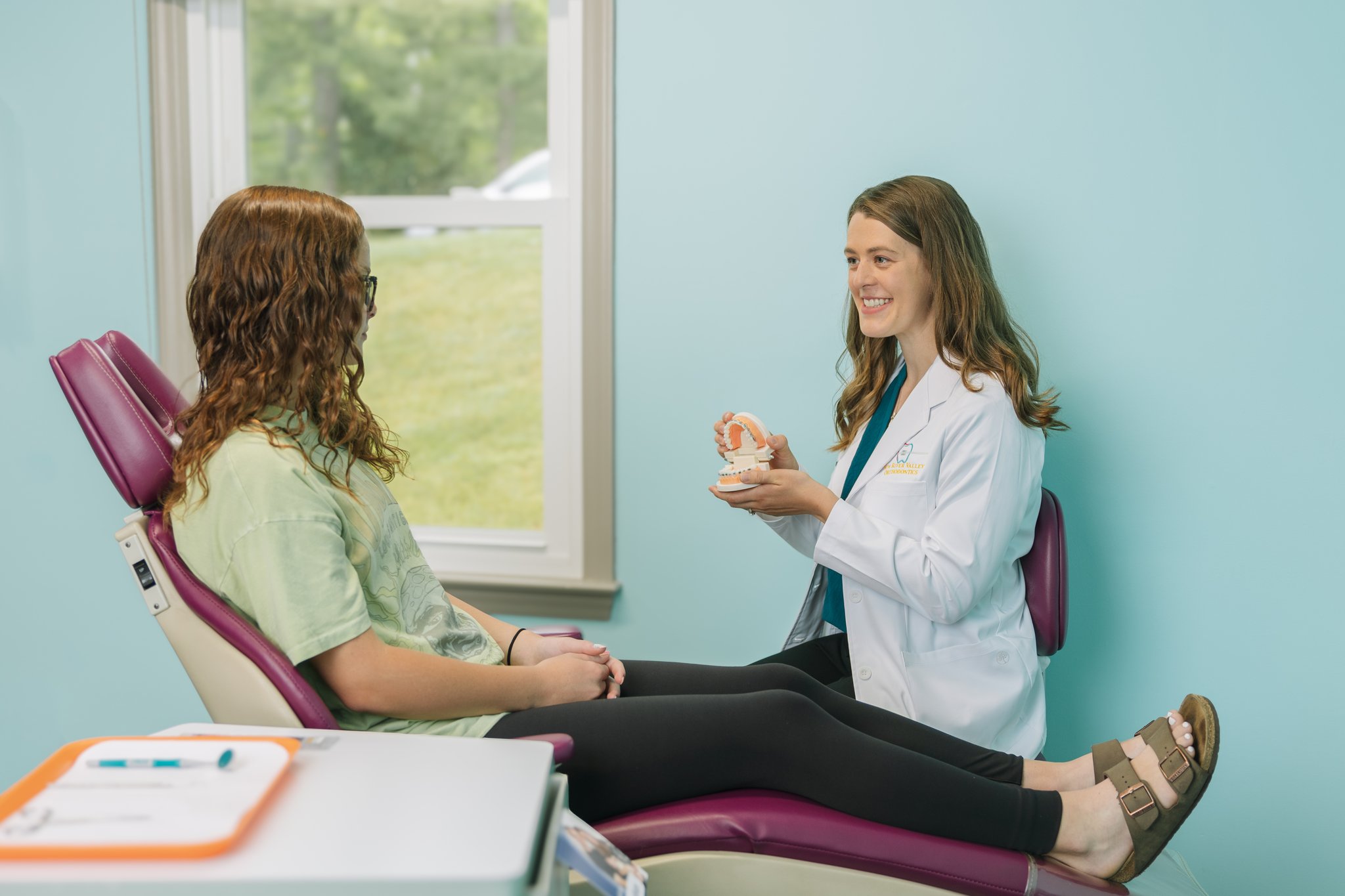 Doctor explaining traditional braces at New River Valley Orthodontics